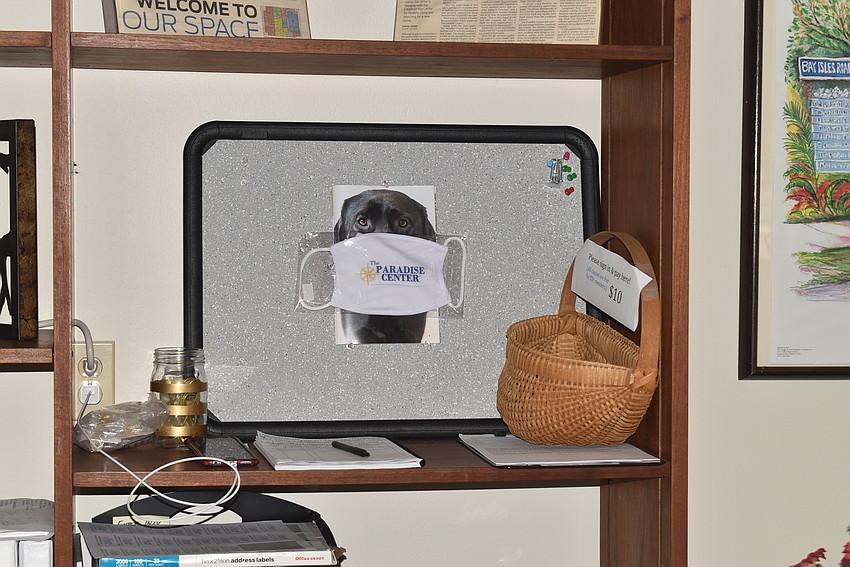 Even a photo of Brenner's dog has a mask at the Paradise Center.