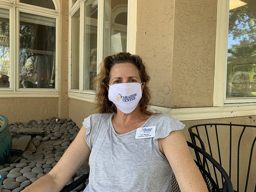 Suzy Brenner wears a Paradise Center mask.