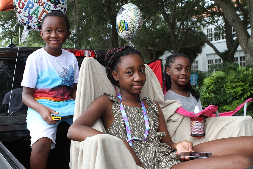 Courtney Benton and Shaniaiah and Anissa Austin were ready for the parade to start.