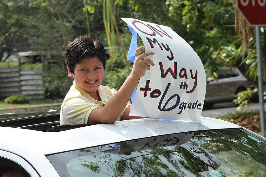 Zacharay Cuadra stood up through the sun roof.