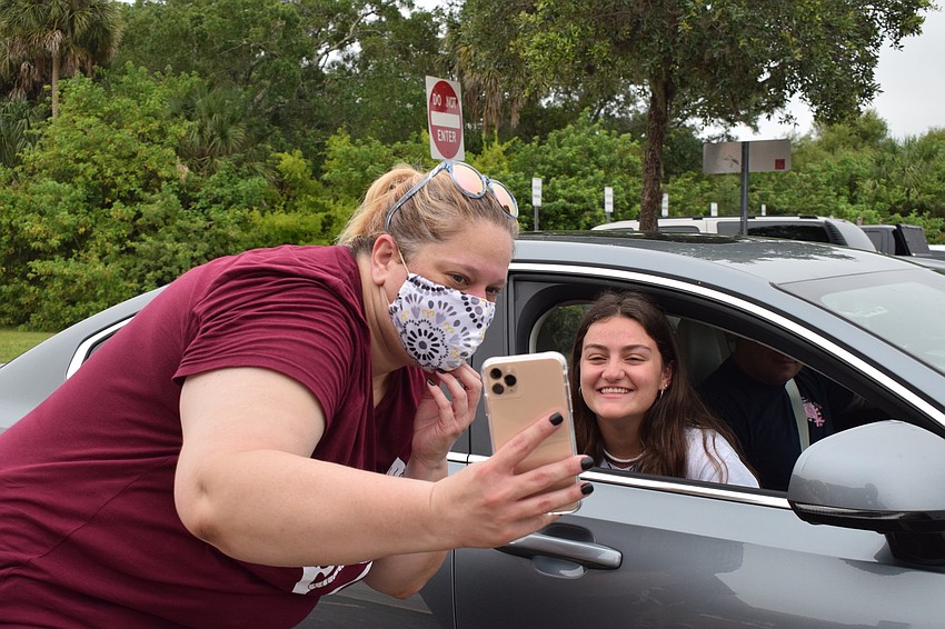 Marybeth Witham, a science teacher and senior advisor, takes a selfie with senior Jesenia Haslem.