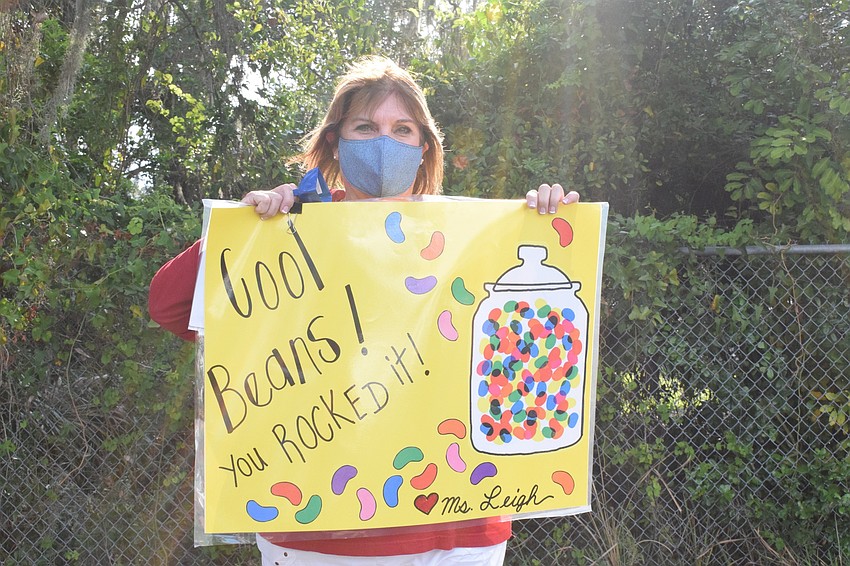 Dudley Leigh, curriculum and arts coordinator at Rowlett Middle Academy, helps make the school's eighth graders' last day of school memorable. Leigh hasn't seen the eighth graders since the school moved to e-learning in March.