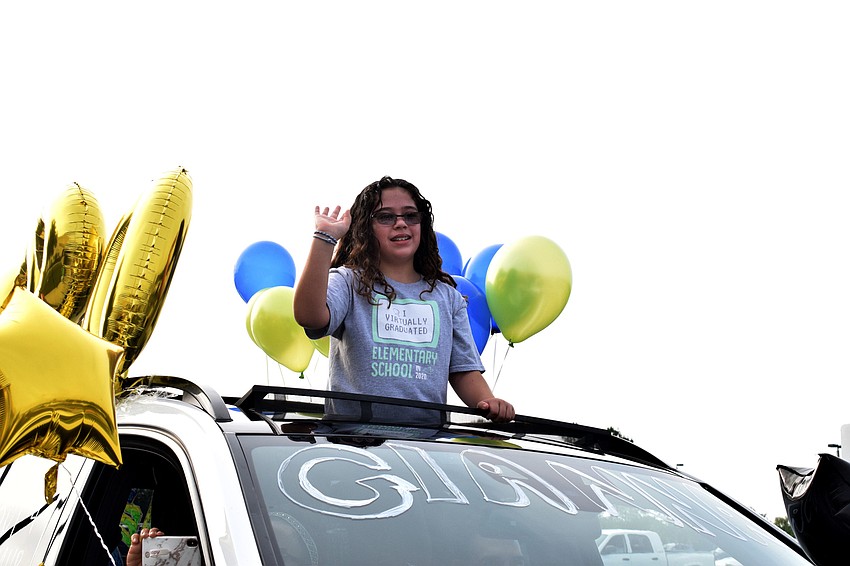 Gianna Demino, a fifth grader at Robert E. Willis Elementary, is the first in line at the parade.