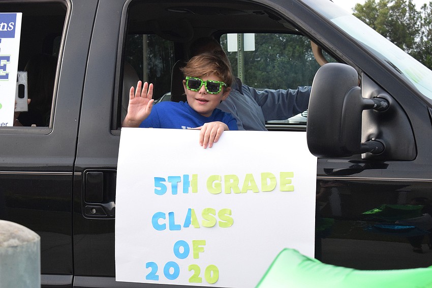Robert E. Willis Elementary School fifth grader Jake Martin leaves elementary school with a smile on his face.