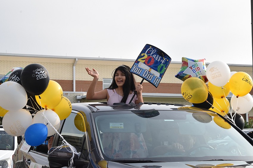 Emily Gonzalez, a fifth grader, does not hold back with car decorations to celebrate her graduation from elementary school.