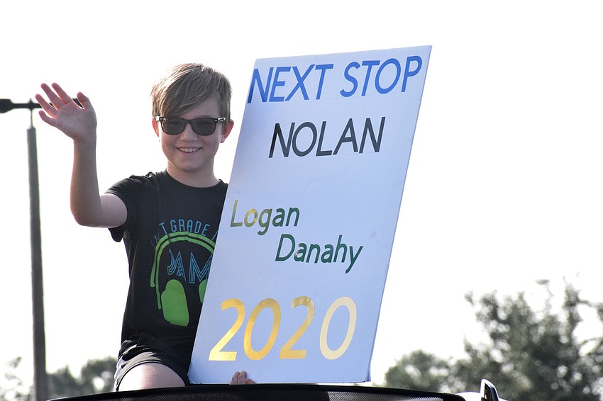 Logan Danahy, a fifth grader at Robert E. Willis Elementary School, celebrates his graduation from elementary school. He'll move onto R. Dan Nolan Middle School in the fall.