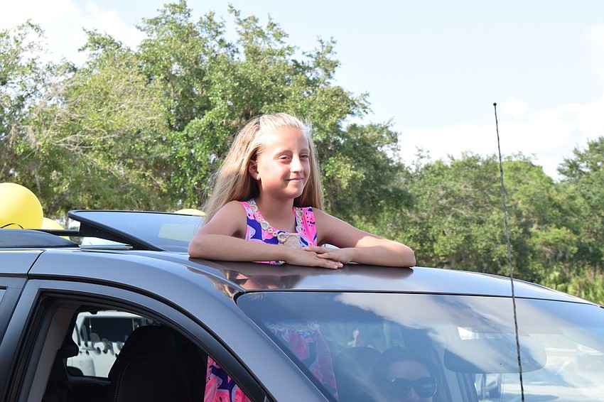 Paige Sponable, a fifth grader at Gene Witt Elementary School, enjoys seeing her teachers after months of being out of the classroom.