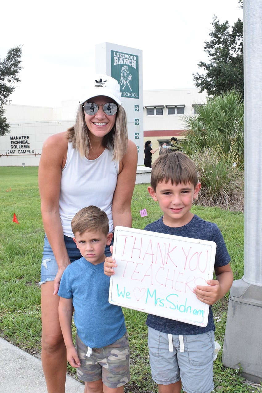 Danielle Caiano bring her 3-year-old son Luca and 6-year-old son Leo to Manatee Technical College's east campus to see the Manatee Strong parade. Leo and Luca hoped to see firetrucks because they love emergency vehicles.