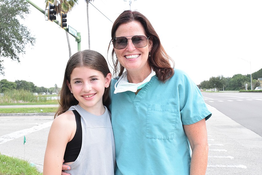 Isabella and Patricia Juliano celebrate the last day of school while seeing the School District of Manatee County Manatee Strong parade.