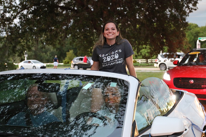 Senior Hannah Greenblott sits in her family's convertible while going through the parade. Out-of-Door Academy surprised seniors with fireworks after the parade. Courtesy photo.