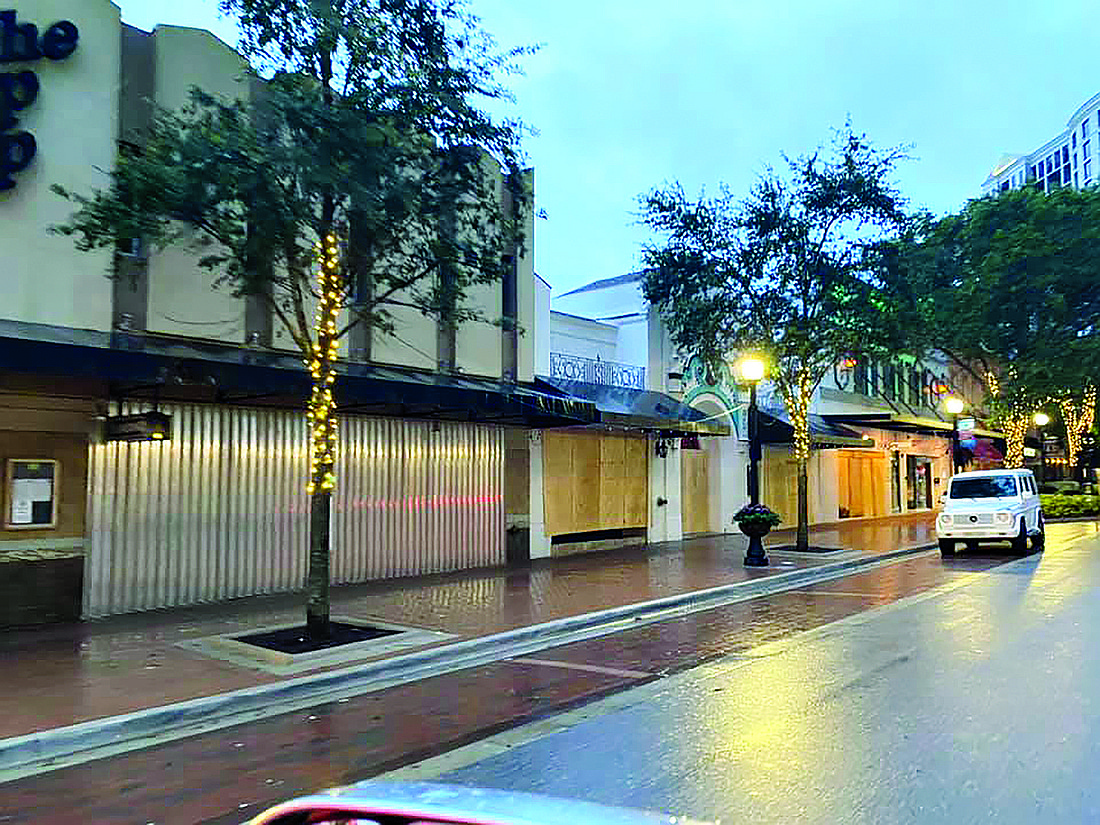 (Photo courtesy  of Scott Gerber Main) Street property owners and businesses in downtown Sarasota prepared for the worst last week.