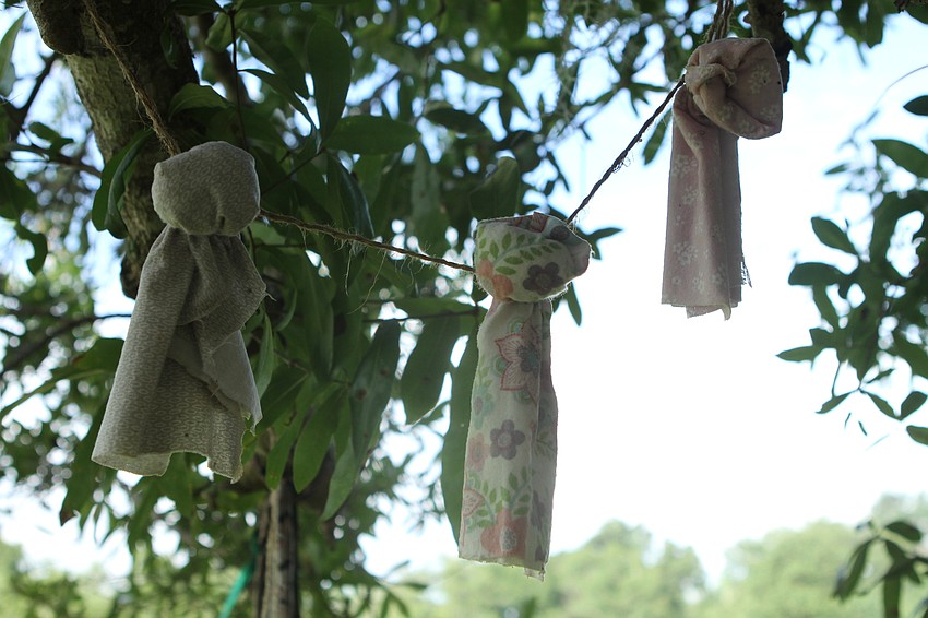 Church members hung prayer ties to the tree.