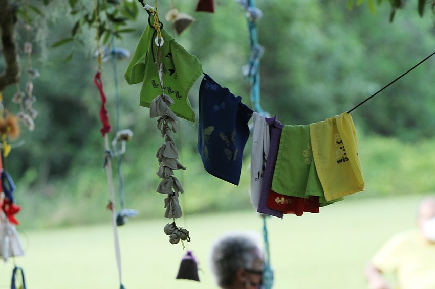 Church members hung prayer ties to the tree.
