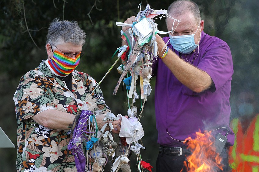 Pastor Tony Viglione put the prayer ties onto the fire.