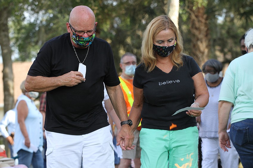 Allen and Janalee Heinemann approached the fire.