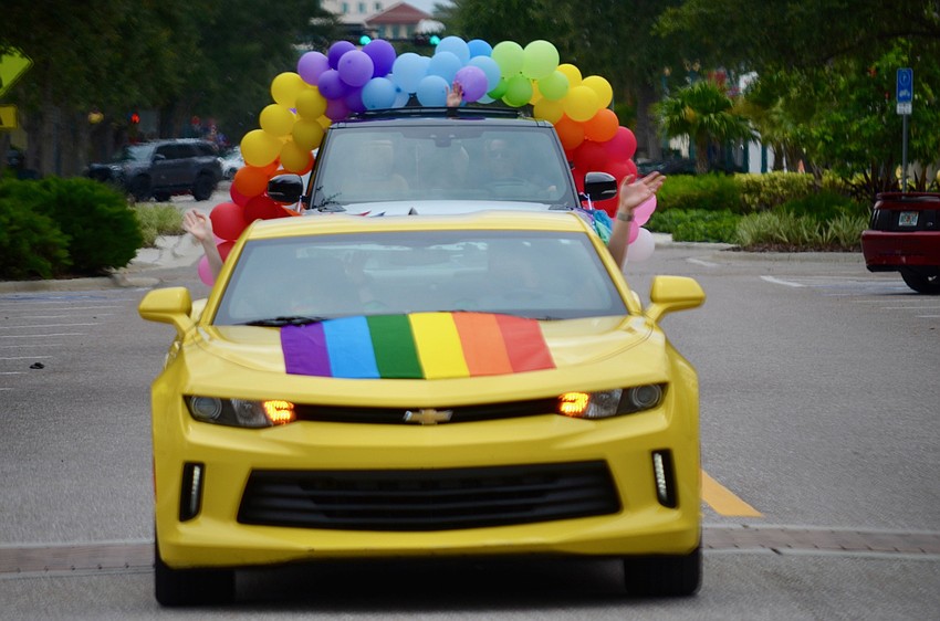 The first car began the parade around 1 p.m. on Saturday.