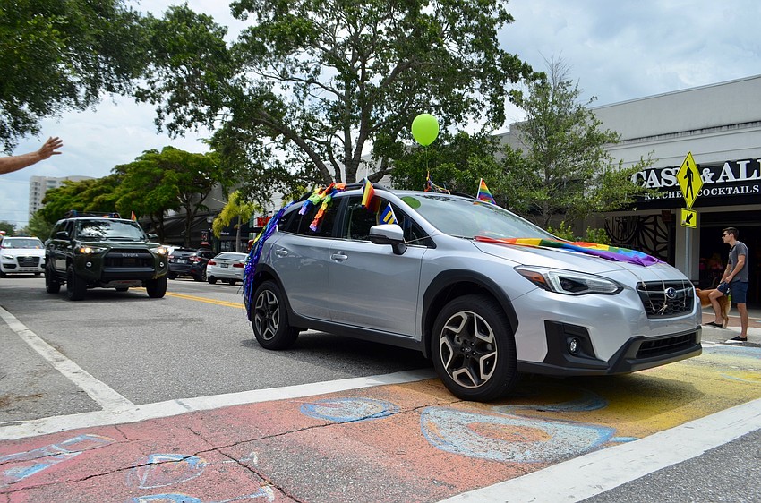 Cars drove slowly down Main Street, which remained open to traffic.