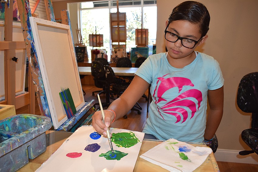 Lakewood Ranch 8-year-old Bella Bassett adds color to the Father's Day project for her dad, Tony Bassett.