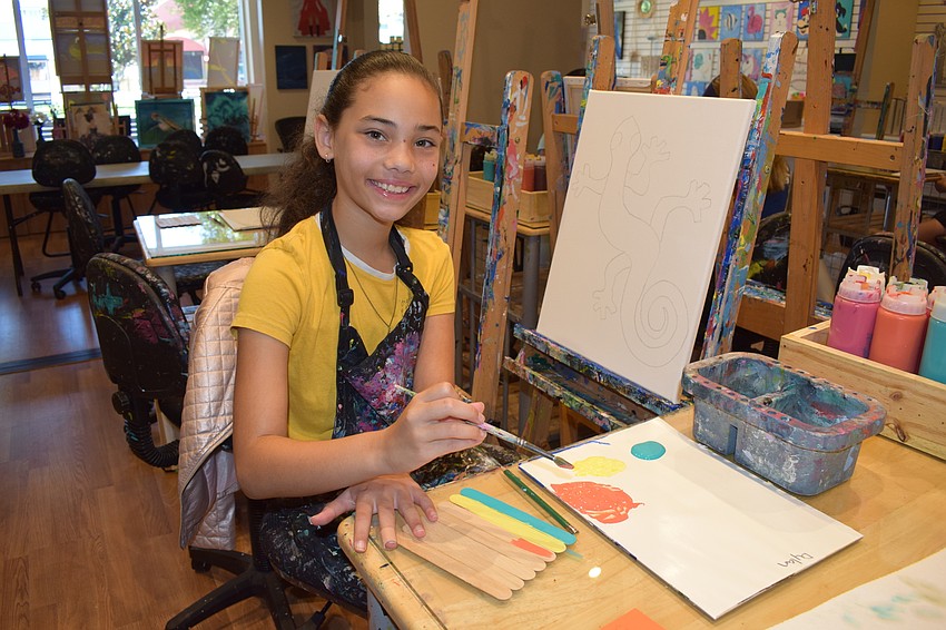 Lakwood Ranch 9-year-old Dylan McBrayer looks up from the Father's Day project she is doing for her dad.