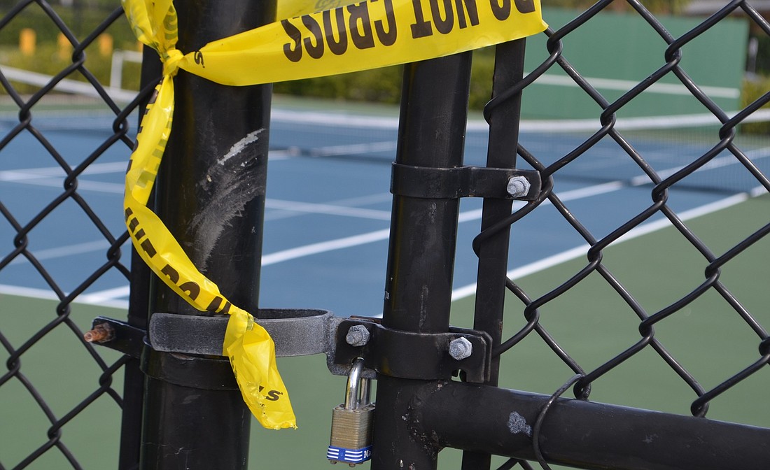 Courts at Bayfront Park have been marked as closed and their gates locked.