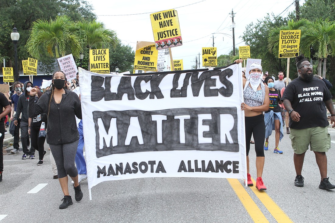 Protesters rallied against racial injustice and police violence during a march from Dr. Martin Luther King Way to University Parkway on Saturday, June 6.