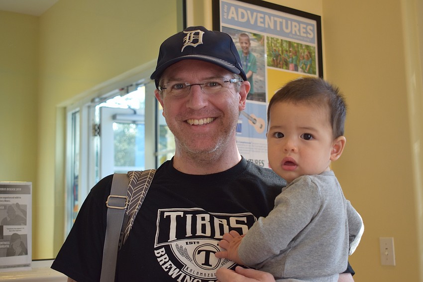 Ryan McCleary celebrates his first Father's Day with his son Colin, who is 7 months old, during Kiddie Academy's Donuts with Dad.