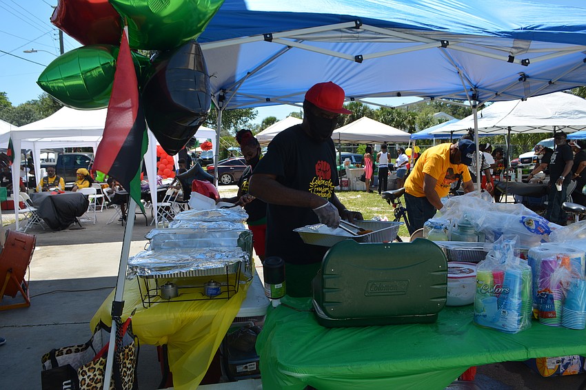 Horace and Momme Ewer of Tuby's Cafe serve up food.
