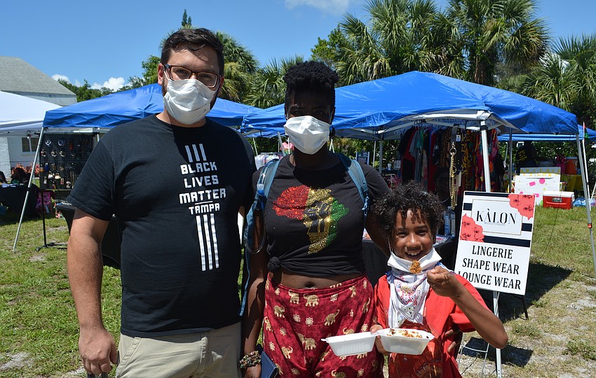 Andrew Maguire, Audrey Luck and William Maguire visited several of the food and merchandise vendors at Saturday’s festival.