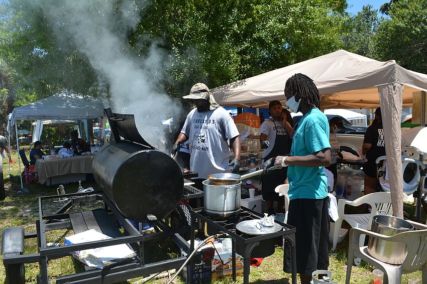 Workers at Chucky D's Bar-B-Que prepare food.