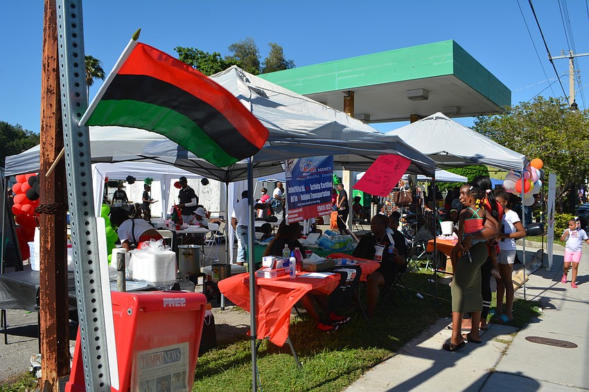 Flags, balloons and other decorations lined the street.