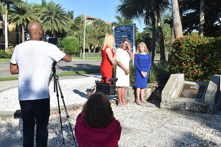 The women stand for their final shot.