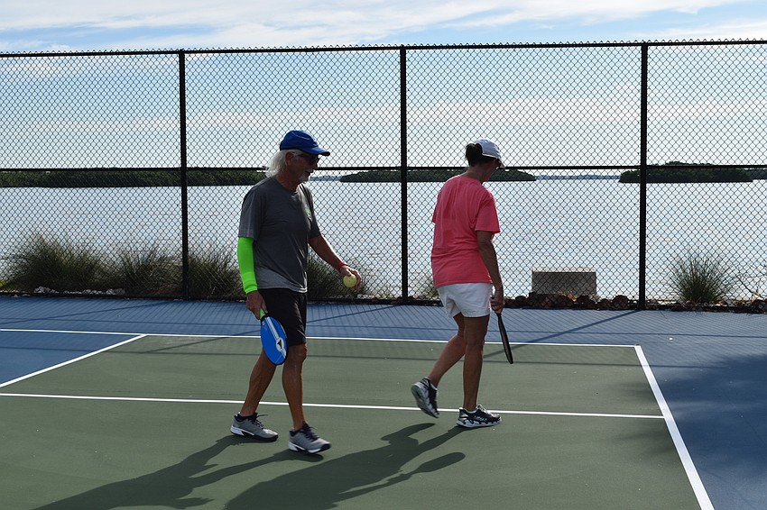 Bob Gordon and Nina Landgraf strategize while playing doubles pickleball on June 22, 2020 at Bayfront Park in Longboat Key, Florida.