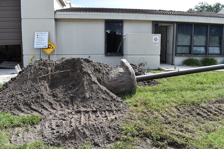 Crews took down the flag pole at the Longboat Key fire station.
