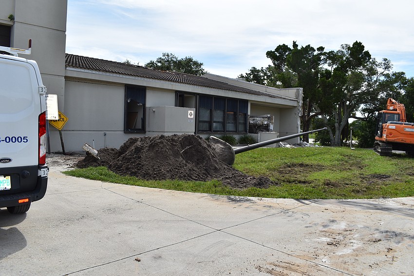 Crews took down the flag pole at the Longboat Key fire station.