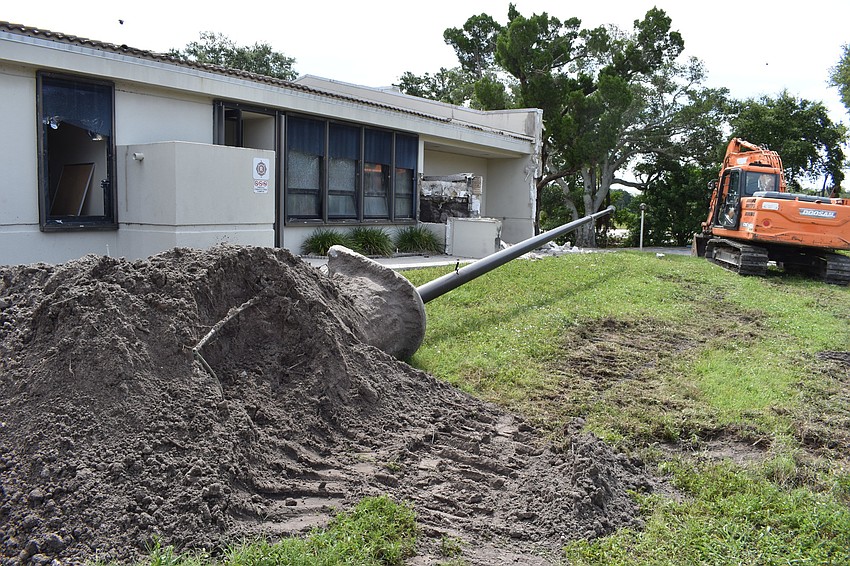Crews took down the flag pole at the Longboat Key fire station.