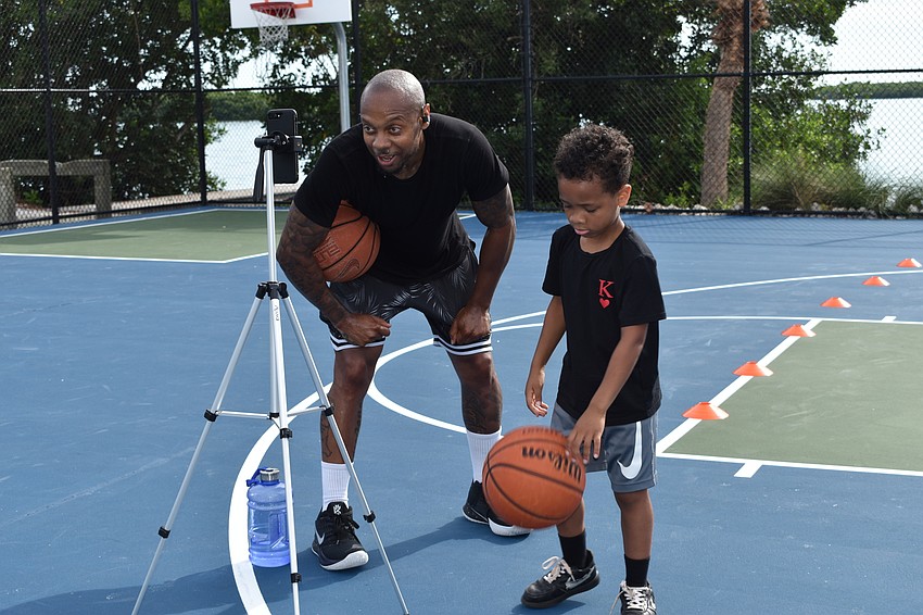 Tim Grant (left) and King Grant (right) communicated with clients in South Korea via Facebook Live on Monday, June 22, 2020, at Bayfront Park.