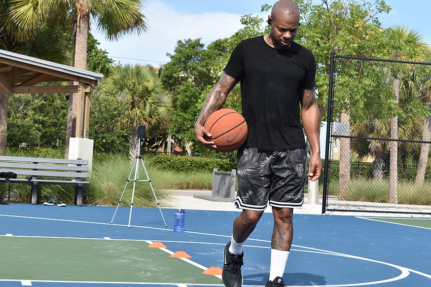 Tim Grant performs a dribbling drill for a client of his on Facebook Live. Grant uses a Bluetooth headset to communicate while livestreaming.