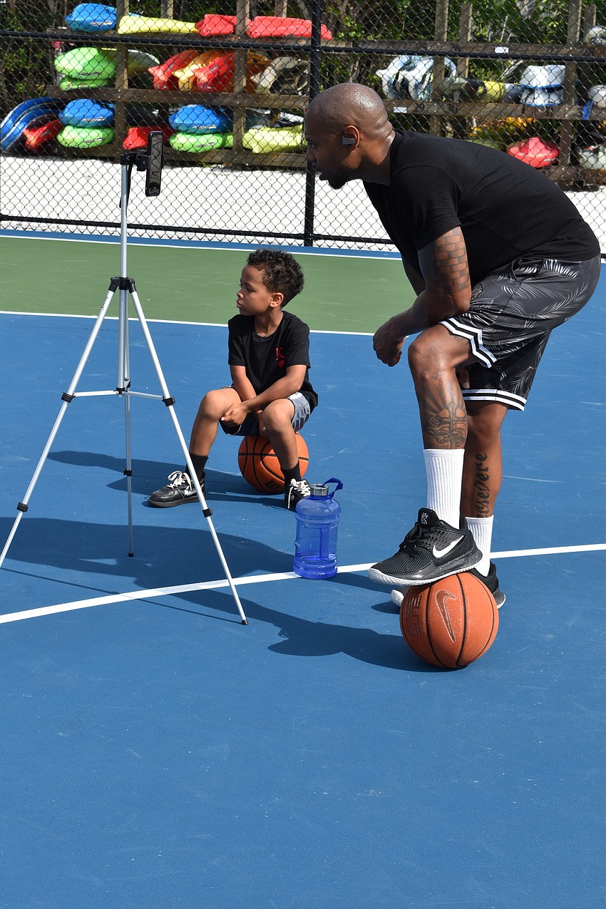 King Grant (left) and Tim Grant (right) communicated with clients in South Korea via Facebook Live on Monday, June 22, 2020, at Bayfront Park.