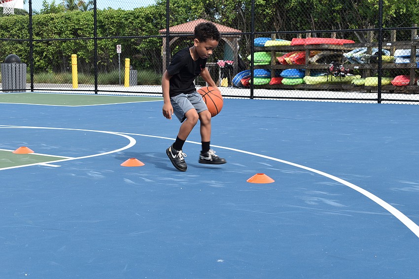 King Grant performs a dribbling drill on Monday, June 22, 2020, at Bayfront Park.