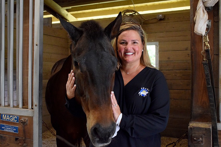 Rebecca Blitz, executive director of Sarasota-Manatee Association for Riding Therapy, enjoys working with the kids during the summer camp. This is the first year the nonprofit has had a summer camp.