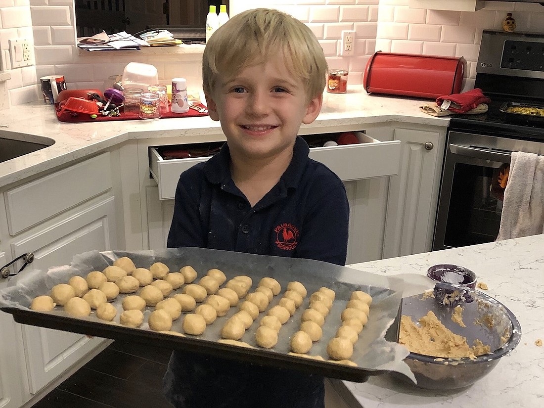 Alexander enjoys helping make buckeyes, peanut butter balls dipped in chocolate, though he oddly enough doesnâ€™t eat them when theyâ€™re done.
