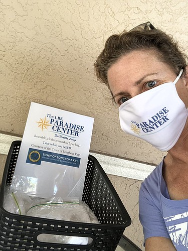 The Paradise Center executive director Suzy Brenner is shown taking a selfie with a mask. The facility is one of three in Longboat Key distributing free masks to the public. Photo Courtesy: Suzy Brenner, The Paradise Center