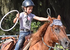 Sarasota's Ellie Connours, age 8, is all business during the camp's final day relay race.