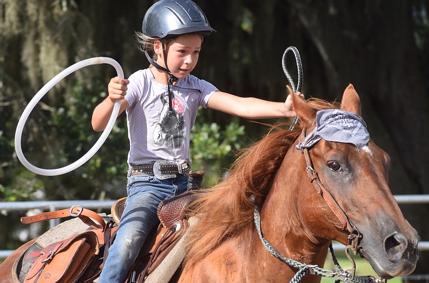 Sarasota's Ellie Connours, age 8, is all business during the camp's final day relay race.
