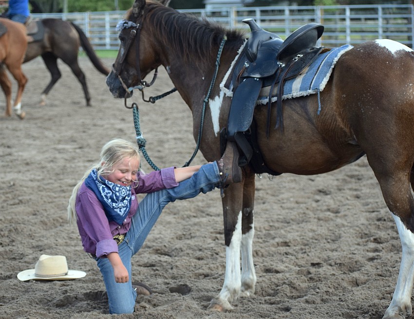 Sometimes things don't go perfectly. Myakka City's Mia Gorskey, 7, smiles after getting her foot caught in the stirrup.