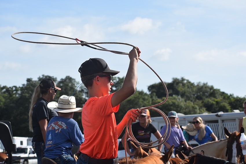 Myakka City's Jake McKendree, 14, warms up for the roping portion of the relay race.