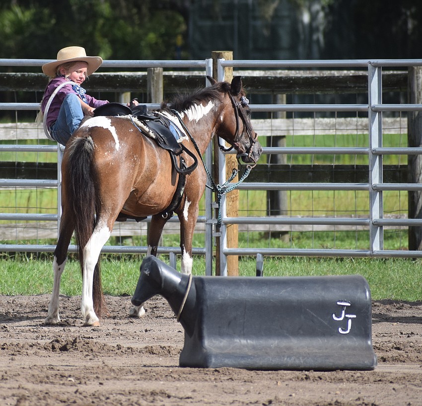 If you fall off your horse, you need to climb back on. And if you are small, like Myakka City's Mia Gorskey, 7, you really need to climb.