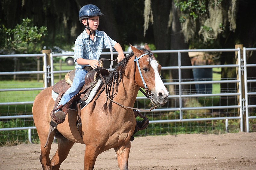 Myakka City's Ethan Snyder, 8, begins his ride the final day of camp.
