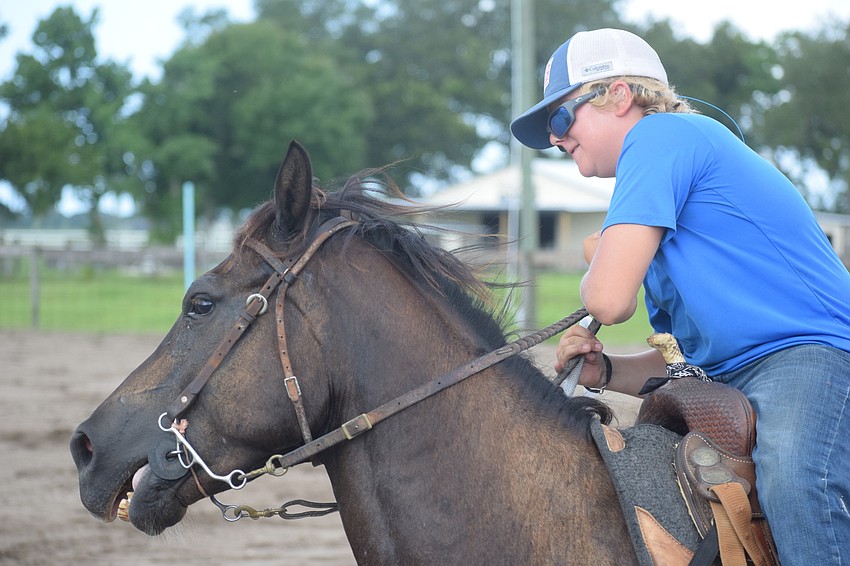 East County's Chase Douglas goes around a barrel.