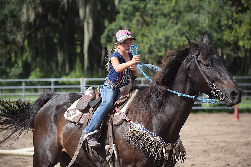 Myakka City's Chaislee Conrad, 7, sprints away to begin a leg of the relay race.